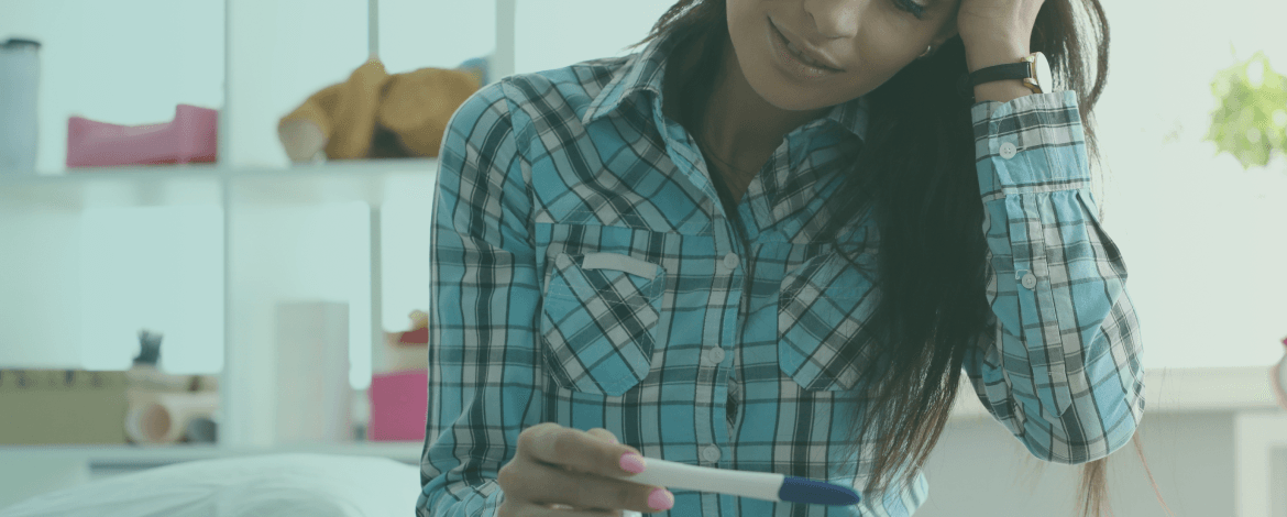 Caring hands holding a small plant sprout, symbolizing natural fertility and new life.